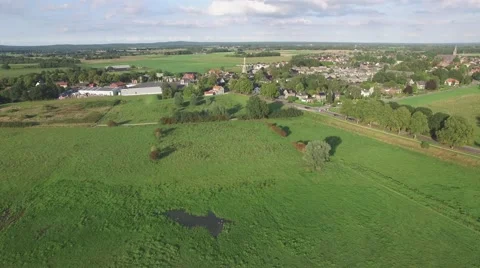 Aerial approaching village with windmill,Ottersum,Netherlands Stock Footage