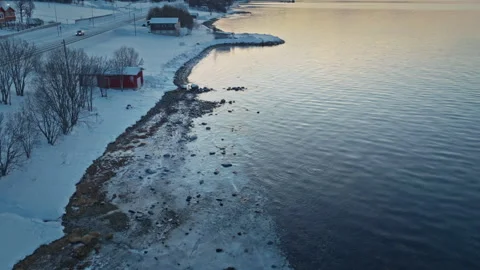 Aerial Arctic Shoreline With Melting Ice Beside Norway Waters Stock Footage 336543053