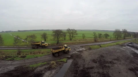 Aerial articulated dumpers all-wheel drive off-road dump trucks 4k Stock Footage 59573927