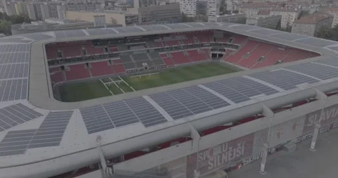 Aerial Ascend &amp; Orbit of Solar-Powered Stadium Stock Footage 255512061