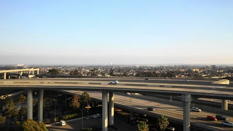 Aerial Ascend, Pan Down-Bustling Multi-Layered Bridges With Town Behind in Los Stock Footage 107180717