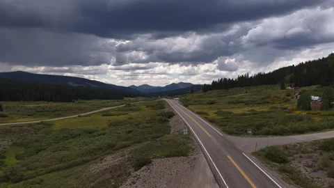 Aerial ascending Lizard head pass south of Telluride Colorado with stormy sky Vídeo Stock 342058035