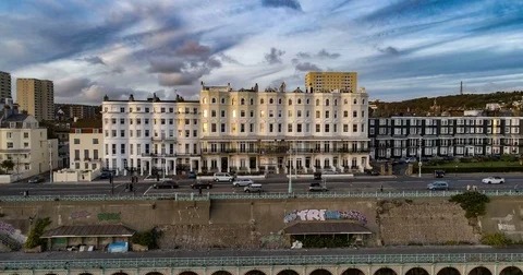 Aerial ascending time lapse view of the town of Brighton at sunset Stock Footage 80622699