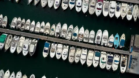 Aerial ascending top down view of docked boats at the pier in Marseille, France. Stockbeeldmateriaal 258802621