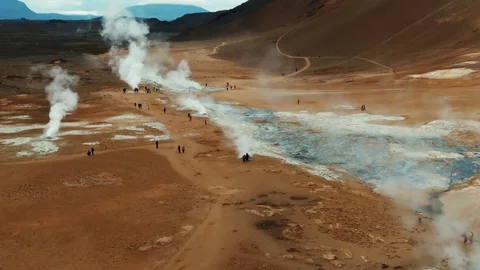 Aerial ascending view of boiling mud pits and fumaroles in Hverir, Iceland Stock Footage 116548724