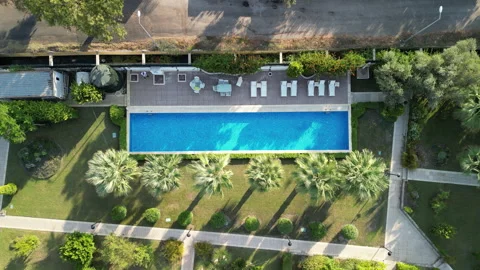 Aerial Ascending View Of A Luxury Swimming Pool Video stock 251065341