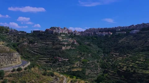 Aerial ascending view of the town of Centuripe in Sicily Stock Footage 294673010