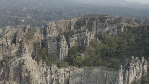 Aerial ascends while tilting down over Los Estoraques formations in Colombia Vídeos de archivo 127907369