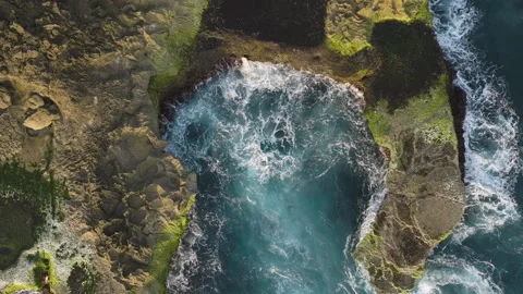 Aerial ascent above Devil's Tears cliffs, showing waves erupting into foam Stock Footage 295040789