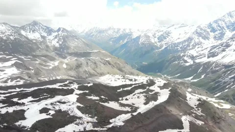 Aerial ascent over snow-capped mountain peaks Stock Footage 337049657