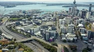 Aerial: Auckland City Skyline And Empty Motorway, New Zealand Stock Footage
