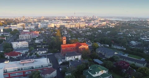 Aerial of Auckland suburb of Newmarket and city skyline, Auckland, New Zealand Stock Footage