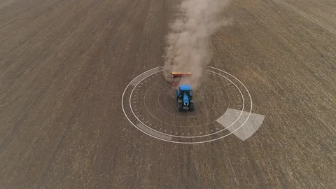Aerial of autopilot tractor cultivating arable land for seeding Stock Footage