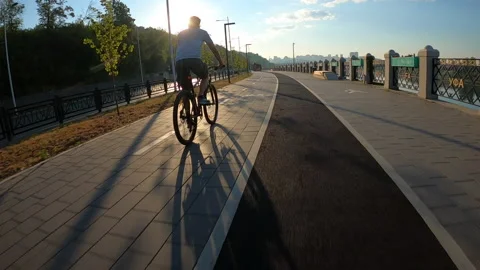 Aerial back view from FPV drone to cyclist riding on mountain bike on bike trail Stock Footage 211817740