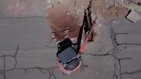 Aerial of a backhoe on a pipe repair project Stock Footage 277857558