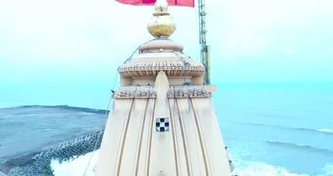Aerial backward drone view of trisula in the top of the mandir in Somnath Stock Footage 195342803