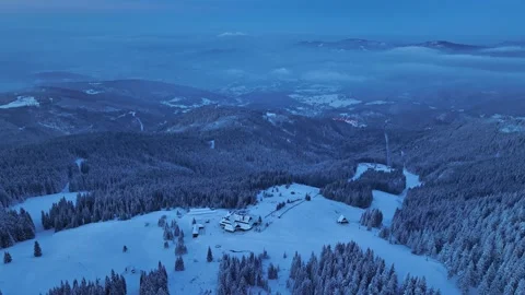 Aerial backward flight during blue hour revealing Hala Miziowa shelter Stock Footage 336365897