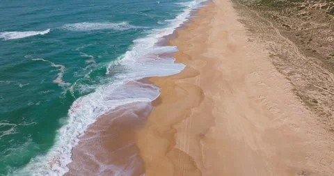 Aerial backward flight over the beach of Nazare, portugal, 4k dci Stock Footage 303284520