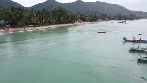 Aerial Backward Flight Over Longtail Boat at Sairee Beach Stock Footage 297619325