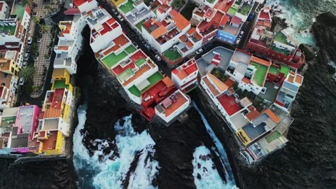 Aerial Backward Reveal Over Rooftops of Punta Brava, Tenerife Stock Footage 346891549