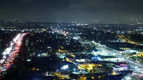 Aerial Backward Shot Of Fireworks Exploding During Celebration In City At Night Stock Footage 264050936