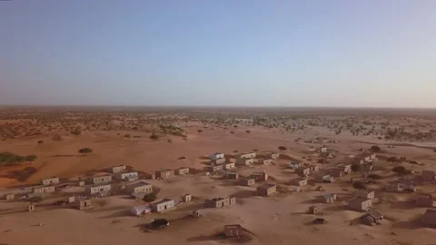 Aerial backward view over a small town in Sahara Desert, West Africa Stock Footage 155719614