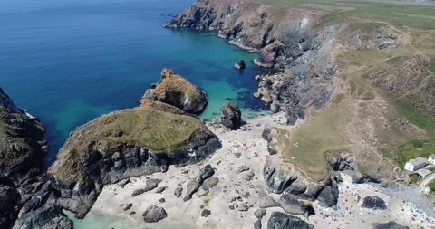 Aerial backwards drone shot overlooking Kynance Cove beach in Cornwall, England Stock Footage 159672410