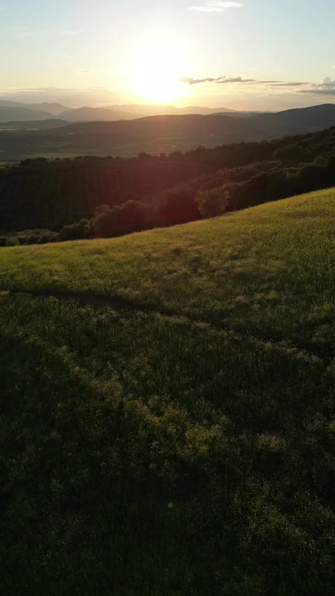 Aerial Backwards Flight Over a Mountain Hill in Tuscany, Grosseto, Italy Stock Footage 340150021