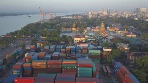 Aerial Backwards over container in terminal with Botahtaung pagoda,Yangon,Burma Stock Footage 100304295