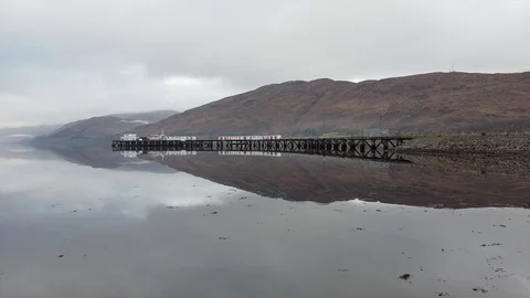 Aerial backwards pan of pier Stock Footage 122215627