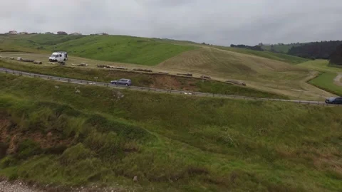 Aerial backwards view from fields to empty playa de Gerra, Cantabria, Spain 4K Stock Footage 155593778