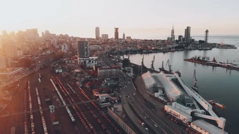 Aerial backwards view freight transportation in Batumi with Railway and highw Stock Footage 166160038