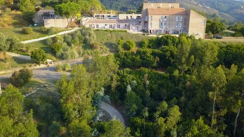 Aerial Backwards View of Hotel Stock Footage 120303515