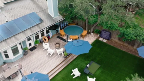 Aerial Backyard Deck Stocktank Pool Blue Umbrellas Adirondack Chairs Lawn Stock Footage 334352296