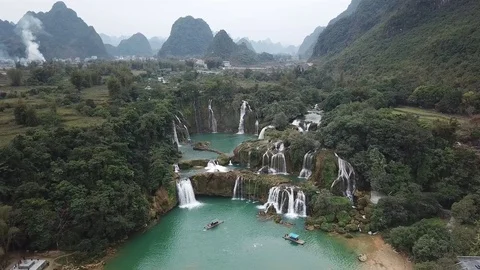 Aerial - Ban Gioc waterfall near mountains and nature in China Stock Footage