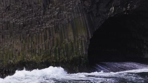 Aerial basalt columns and sea cave on Iceland coast near Vik Stock Footage 340834859