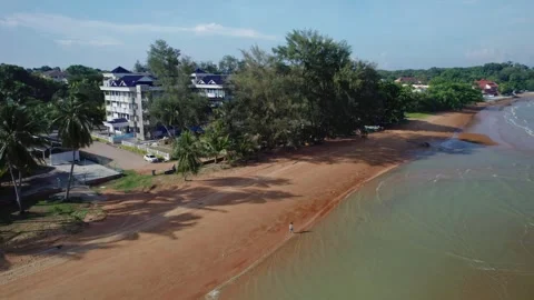 Aerial Beach Scene With Lone Walker Approaching Shoreline Stock Footage 337461290