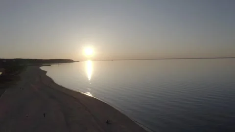 Aerial Beach Sunset Push In away from Shoreline 4K@24FPS DLOG Video stock 297017189