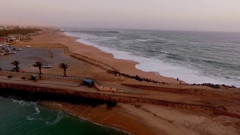 Aerial: The beach in Swakopmund at sunset. Stock Footage