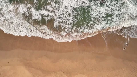 Aerial beach waves with foamy surf symbolizing summer vibes Video stock 341375656