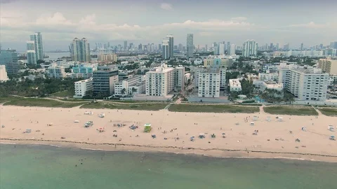 Aerial: beachgoers on South Beach in Mia... | Stock Video | Pond5