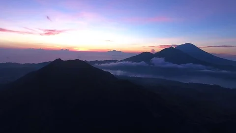 Aerial of beautiful cloudscape and mountain peaks at sunset Stock Footage 81448457