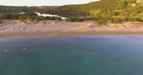 Aerial, beautiful empty beach and cormorants swimming and hunting in a bay in Vídeos de archivo 78941137
