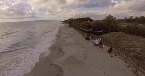 Aerial, beautiful empty sand beach and sea waves on a cloudy day Stock-Footage 84093497