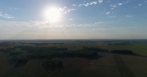 Aerial: Beautiful fields and forests in sun glare near the transport road. Stock Footage 78673160