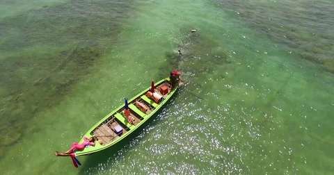 Aerial: Beautiful model is lying on the longtail boat. Thailand. Phuket. Video stock 76712915