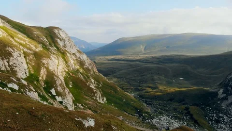 Aerial of beautiful mountain range fly over high epic cliffs rocks. Nature Stock-Footage 99430267