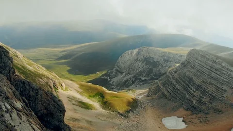 Aerial of beautiful mountain range fly over high epic cliffs rocks. Nature Видео 99430499
