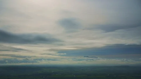 Aerial Of Beautiful Storm Clouds Rolling Over Green Landscape 4K Stock Footage 86083487