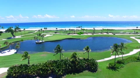Aerial - Beautiful view of Golf Course next to ocean from the sky Stock Footage 66240712